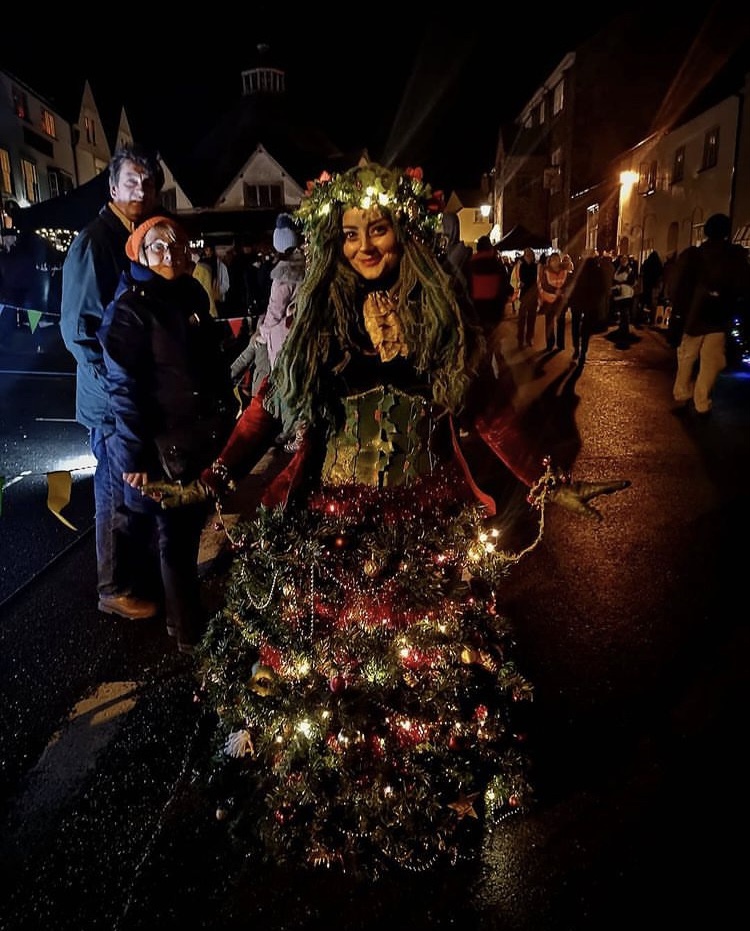 Woman dressed up as Christmas Tree at Dunster By Candlelight -