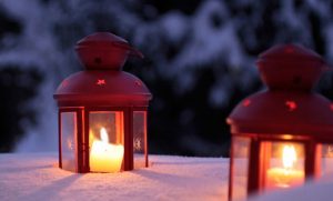 Candles in laterns in snow