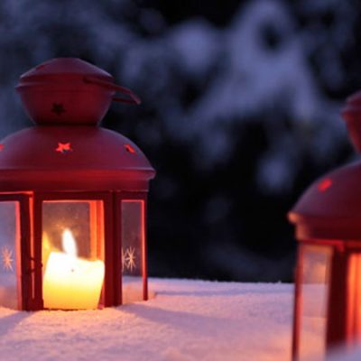Candles in laterns in snow