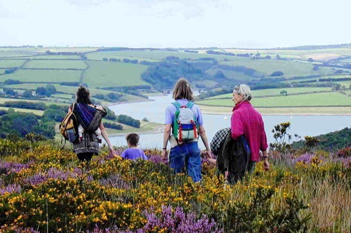 Walkers enjoying the scenic views of Wimbleball Lake, Somerset