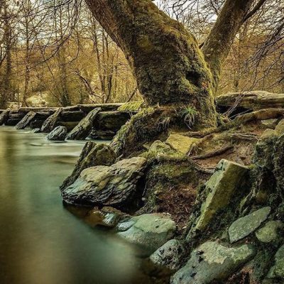 The Tarr Steps from down on the river 