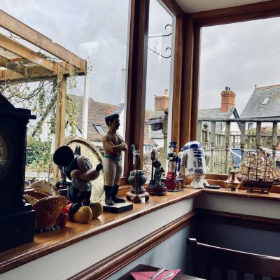 Tchotskes and bric a brac on windowsill of pub