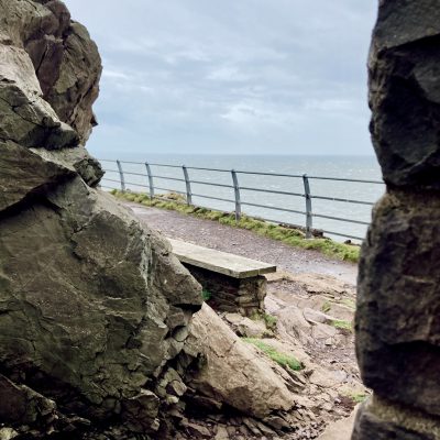 Bench and rocks and railing at Hurlstone Point