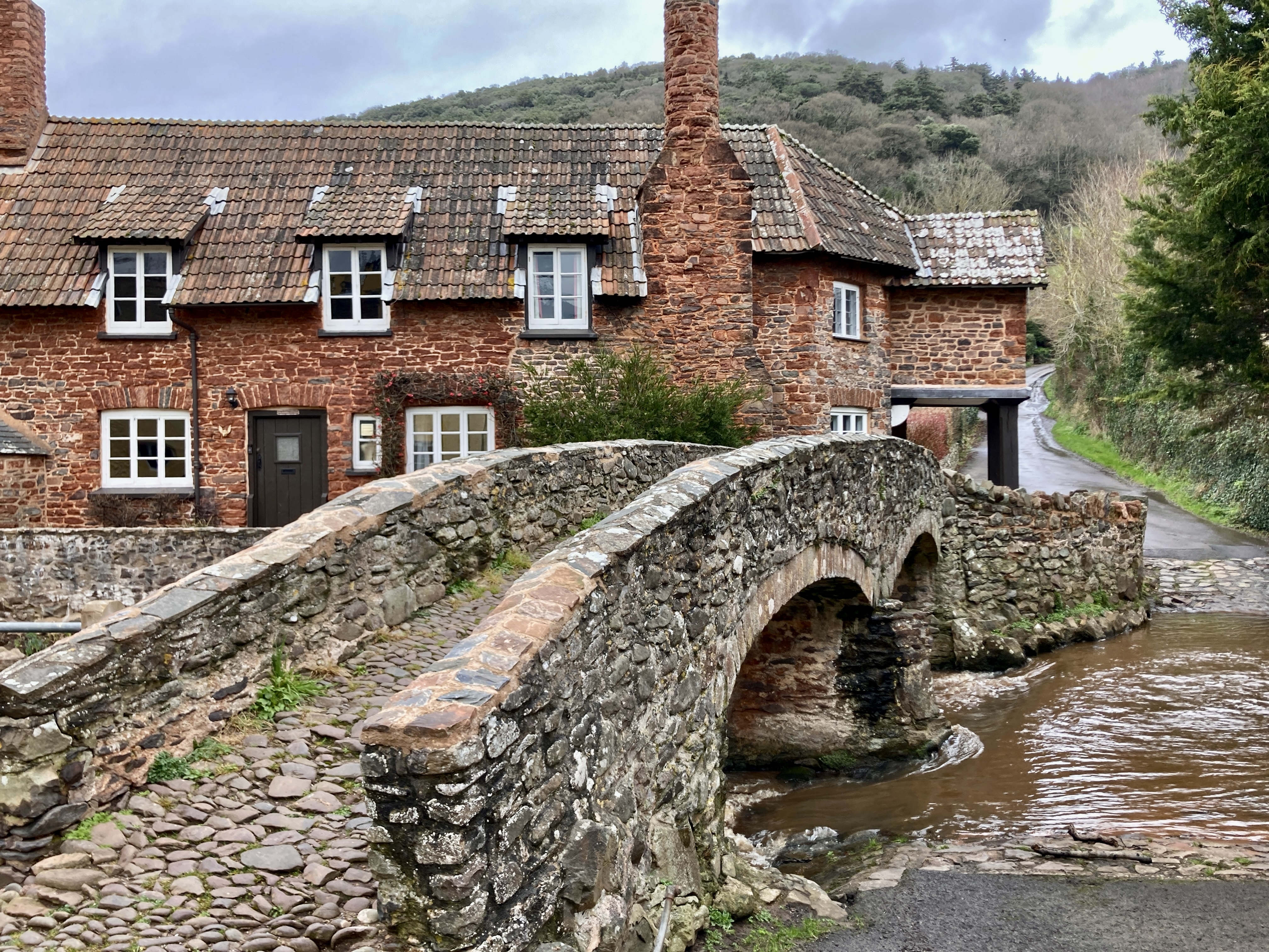 Cobblestone Medieval Historic Backhorse Bridge and house behind it