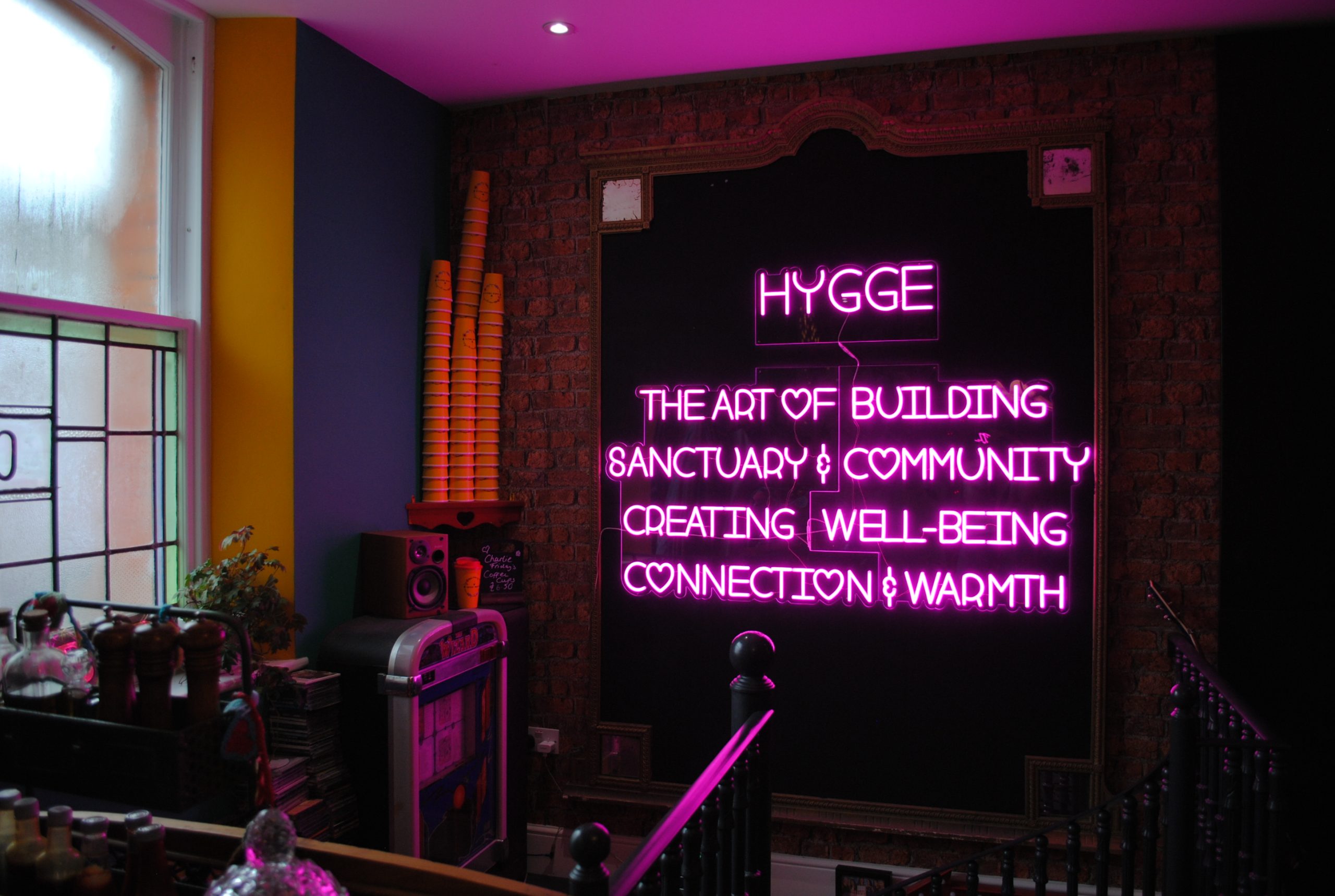 Neon Hygge sign at Charlie Fridays in pink