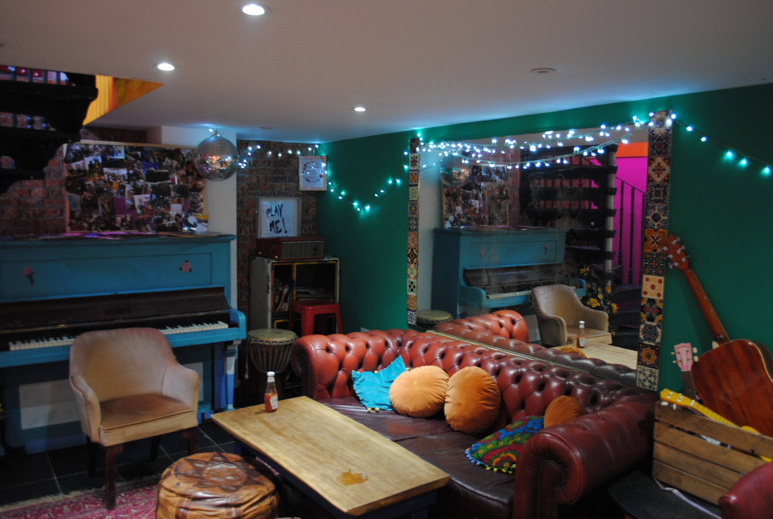 Go this Halloween to Charlie Fridays - here you see the downstairs area with colourful decor, fairy lights and comfortable furniture
