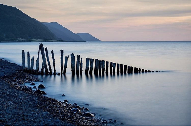 Bossington Beach Porlock Bay Pebbles and Water and sticks barrier