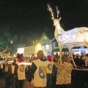 Chrismas On Exmoor Dunster By Candlelight procession with giant glowing reindeer