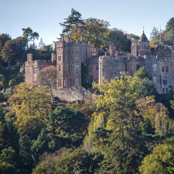 An impressive view of Dunster Castle up on its hill