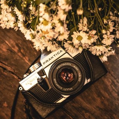 Vintage camera with flowers