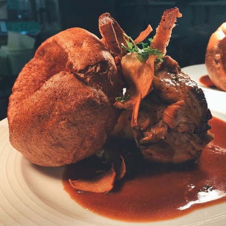 Yummy looking roast lunch with Yorkshire pudding and gravy