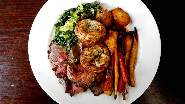 A plate piled high with roast lunch