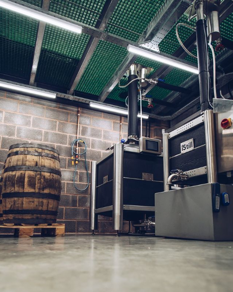 Exmoor Distillery Production Room with barrels and distilling equipment