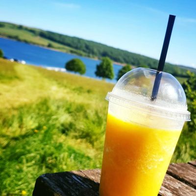 Coffee Couture Juice and View on sunny day at Wimbleball Lake Dulverton