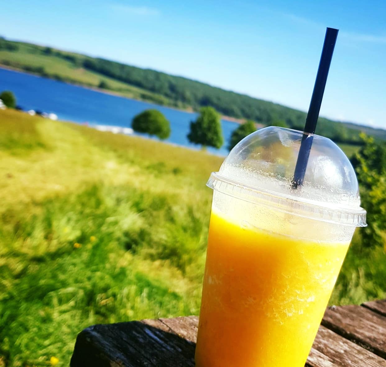 Coffee Couture Juice and View on sunny day at Wimbleball Lake Dulverton