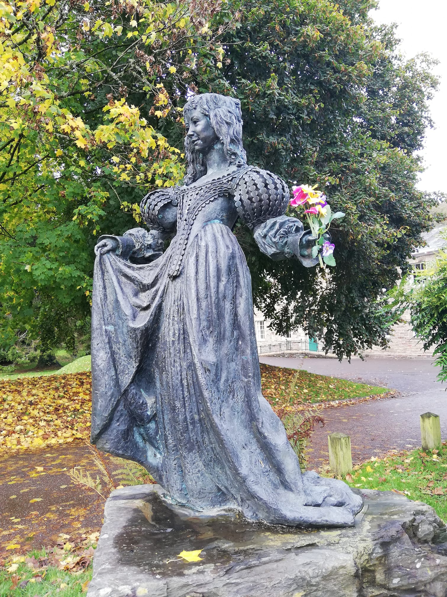 Lorna Doone Statue (bronze statue of a 17th century heroine) with flowers in her hand
